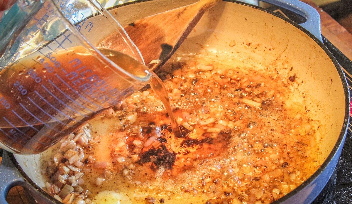 Start the pan sauce with beef stock and diced scallions.