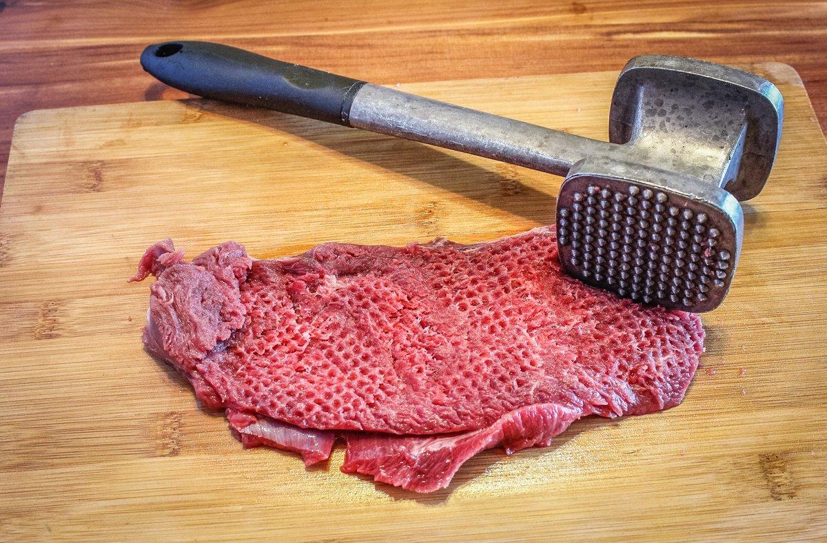 Start by pounding the steaks flat with a meat mallet to make them a little more tender.