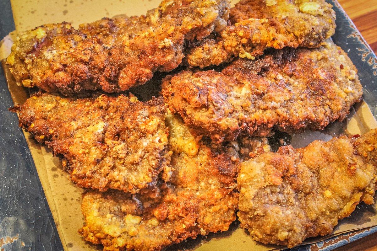 Fry the steaks in batches, moving them to a warm platter once they are finished.