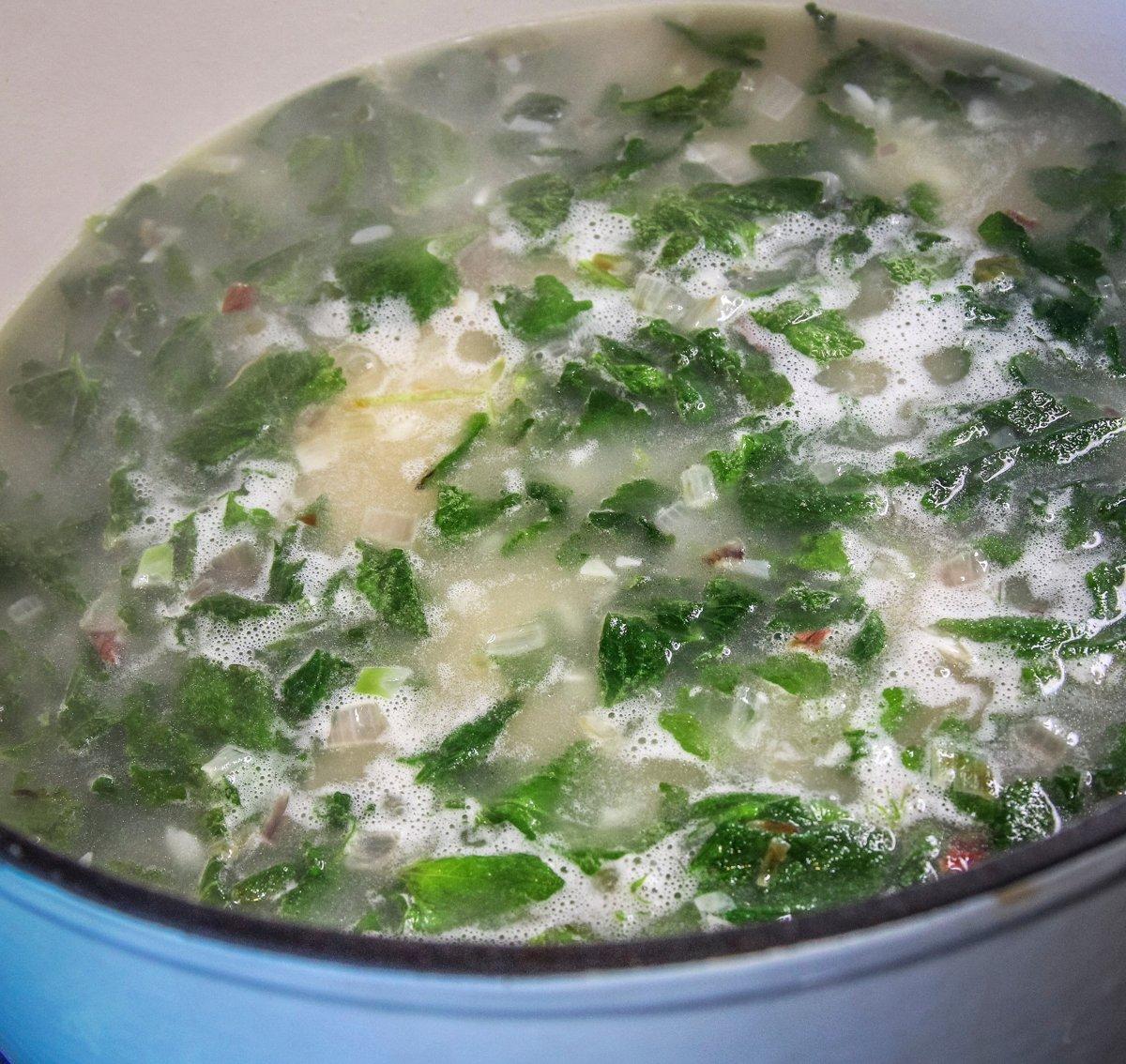 The nettle leaves cook with the rice.