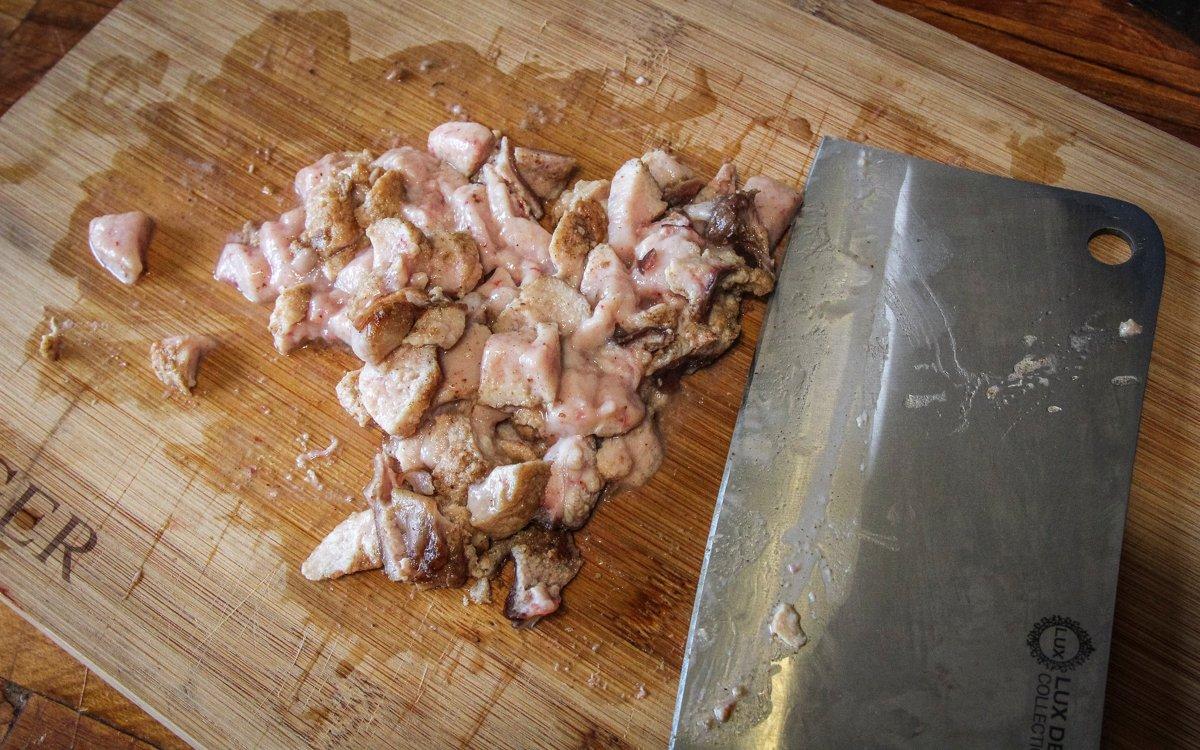 Dice the cooked buck oysters then return them to the pan with the ham and mushrooms.