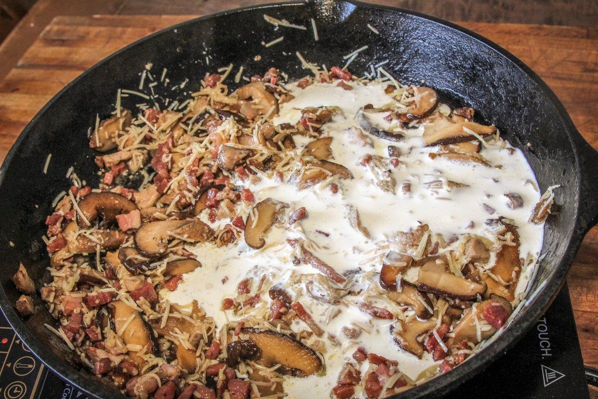 Remove the pan from the heat and add the cheese and cream.