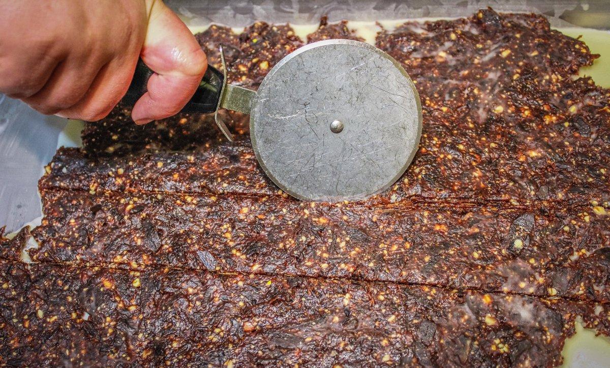 Roll the pemmican flat, then cut it with a pizza cutter.