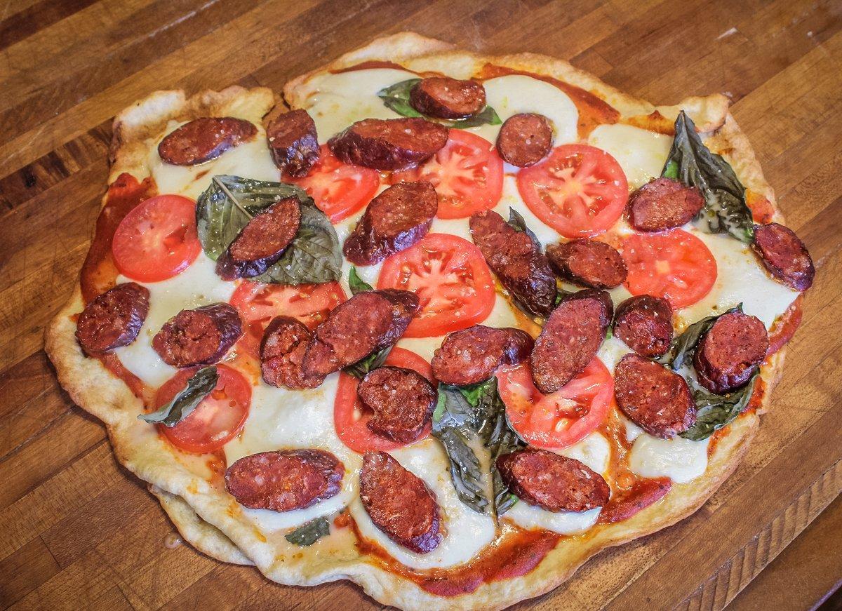 Homemade venison pepperoni is the perfect addition to a wood-fired pizza made on the Traeger Grill.