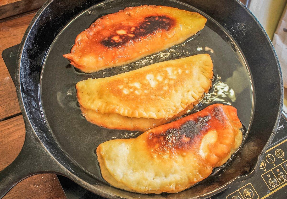 Fry the pies in a skillet for a few minutes per side until they are golden brown and flaky.