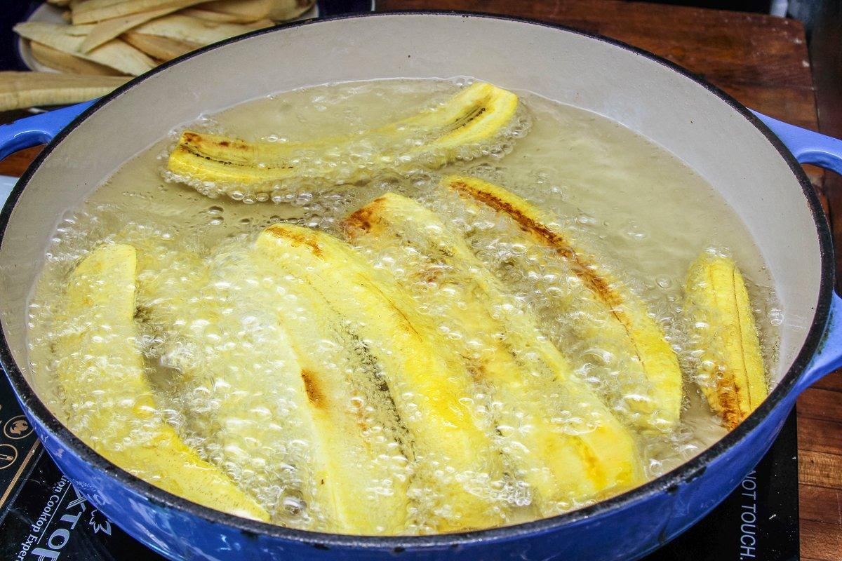 Fry the plantain strips before adding them to the dish.