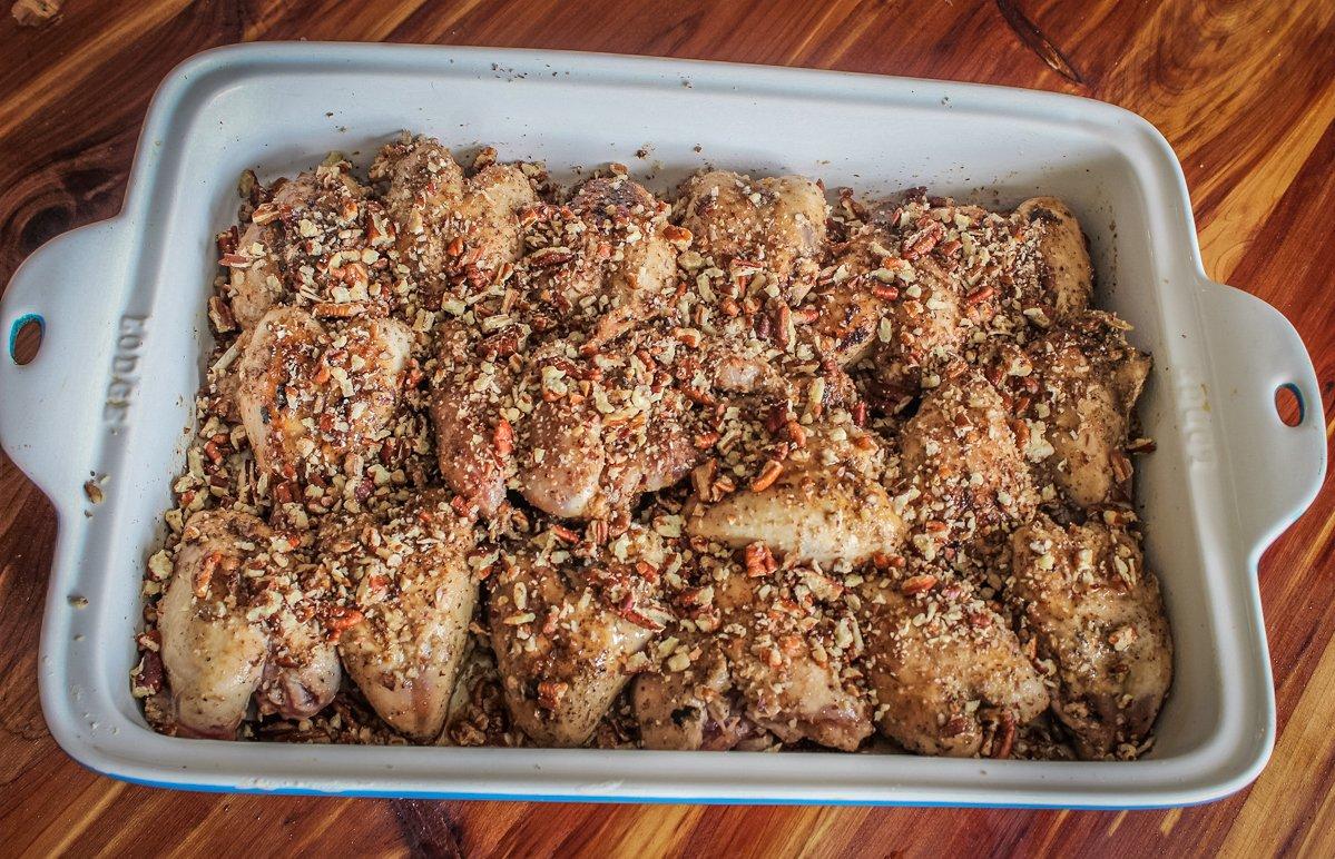 Move the seared quail to an oven proof dish and top with honey and pecans.