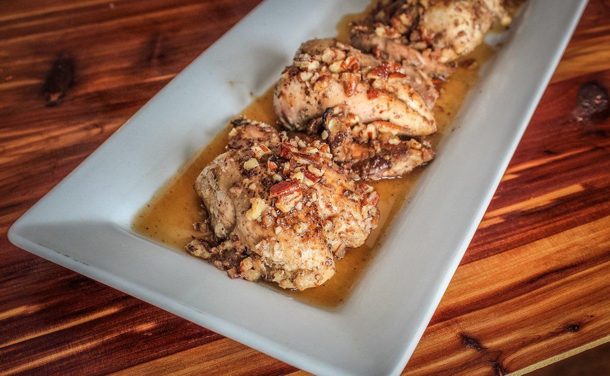 Honey pecan-topped butter braised quail