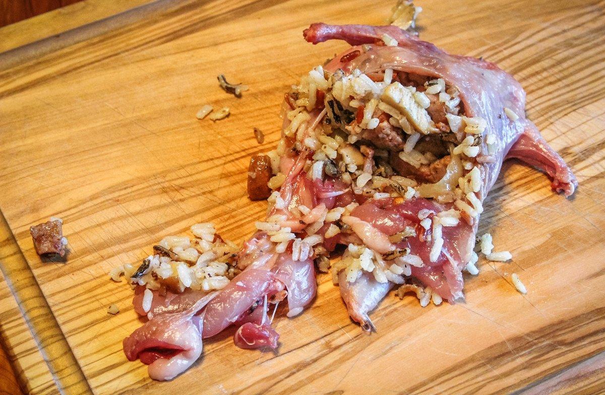 Fill the boneless quail with stuffing. Use toothpicks to secure torn skin.