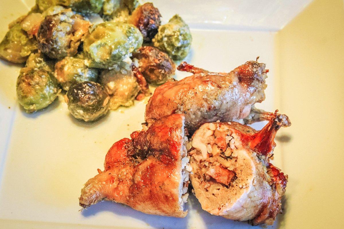 The boneless, stuffed quail are easy to eat with a knife and fork.