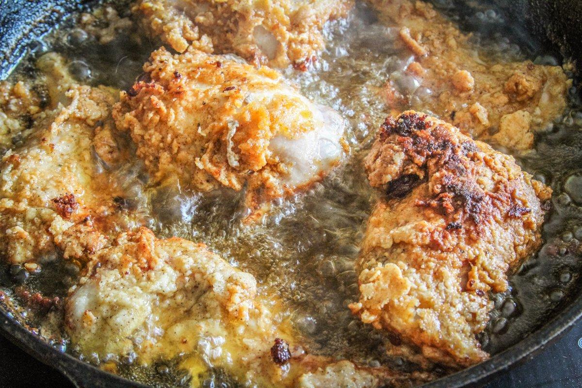 Allowing the crust to set on the rabbit at least 10 minutes before frying helps keep it on the meat.