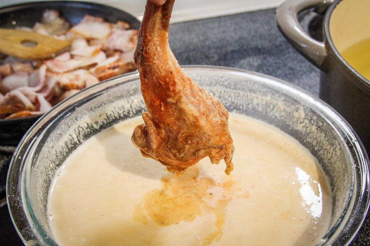 Dip the brined and seasoned rabbit into the batter mixture.