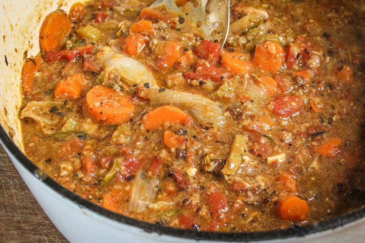 Braise the rabbit in the vegetables until tender, then remove it from the pot.