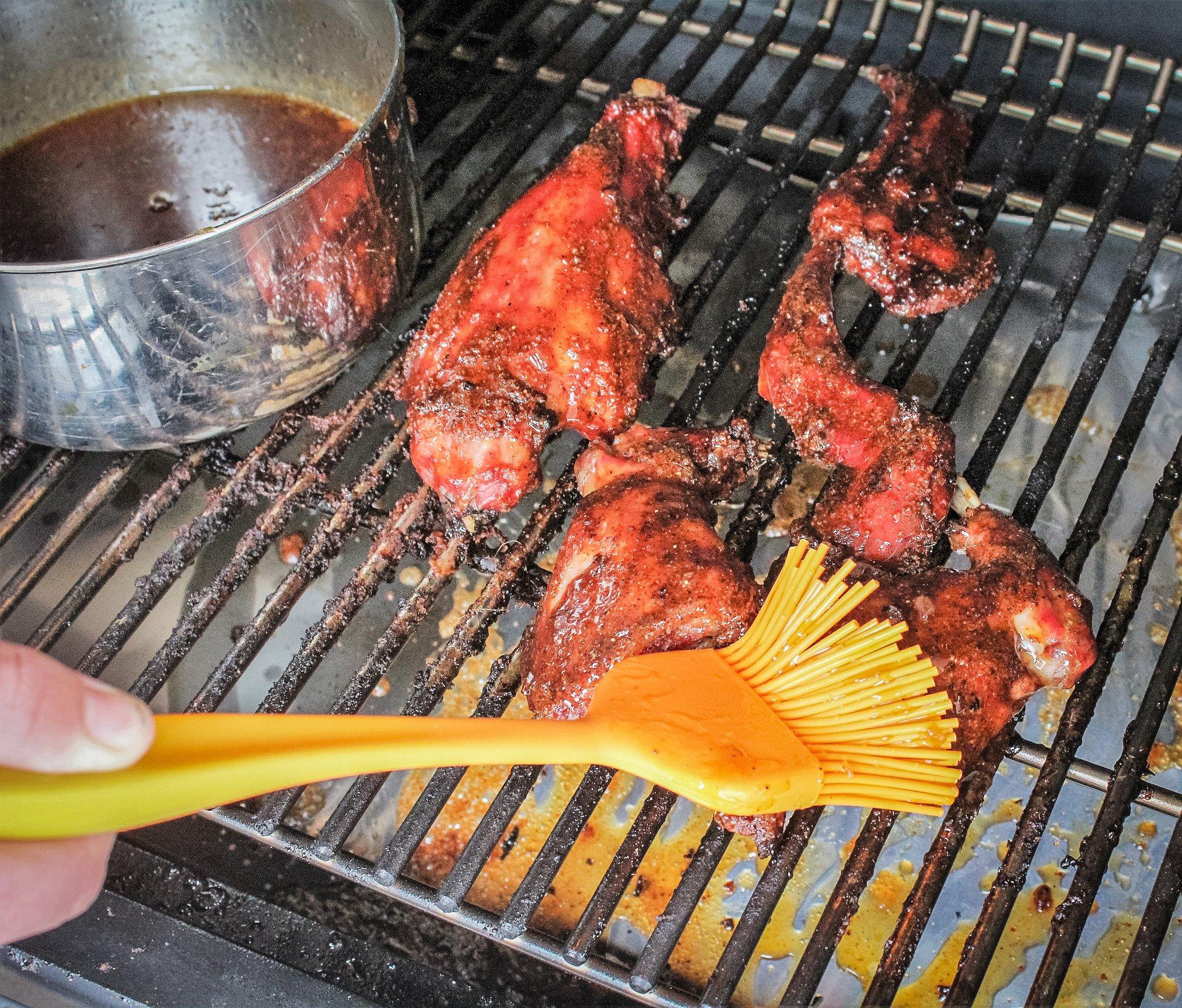 Brush the maple glaze over the raccoon as it grills.