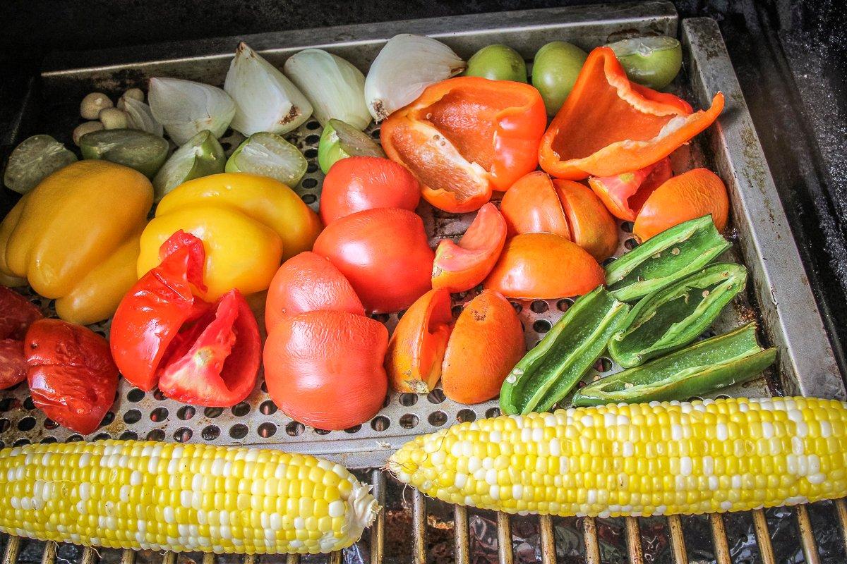 Seed the peppers and tomatoes and peel the garlic before grilling.