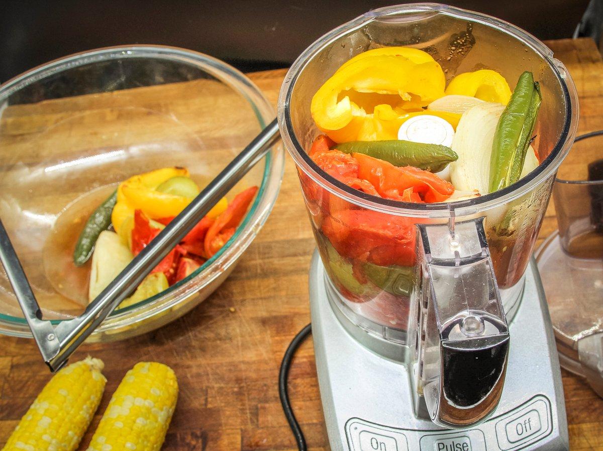 Add the grilled vegetables to the food processor.