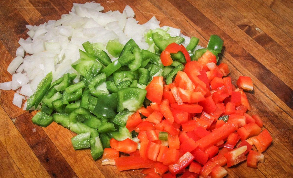 Dice the onion and peppers.