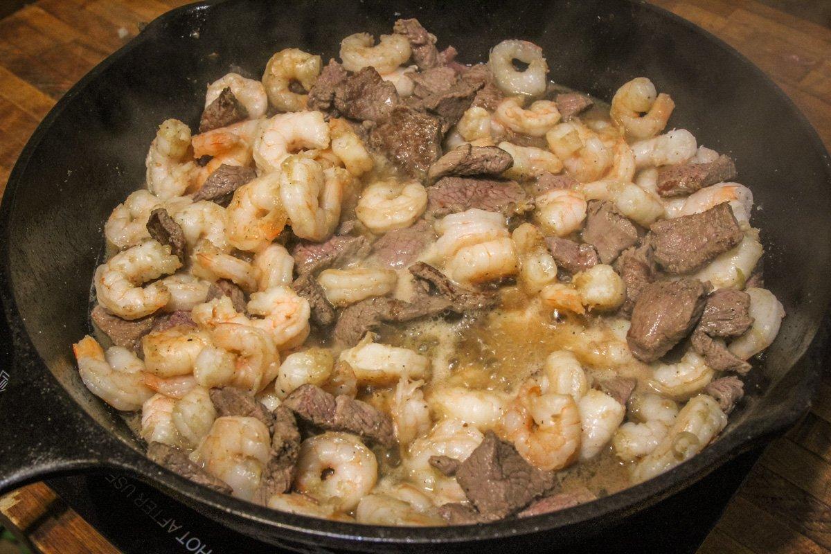 Saute the shrimp and backstrap together.