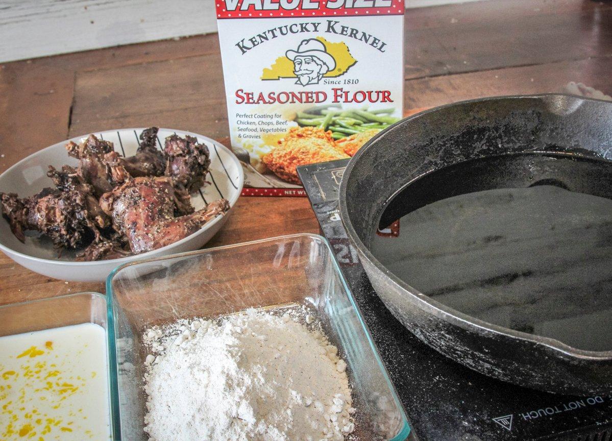 Set up your fry station with seasoned flour and egg wash near your skillet.