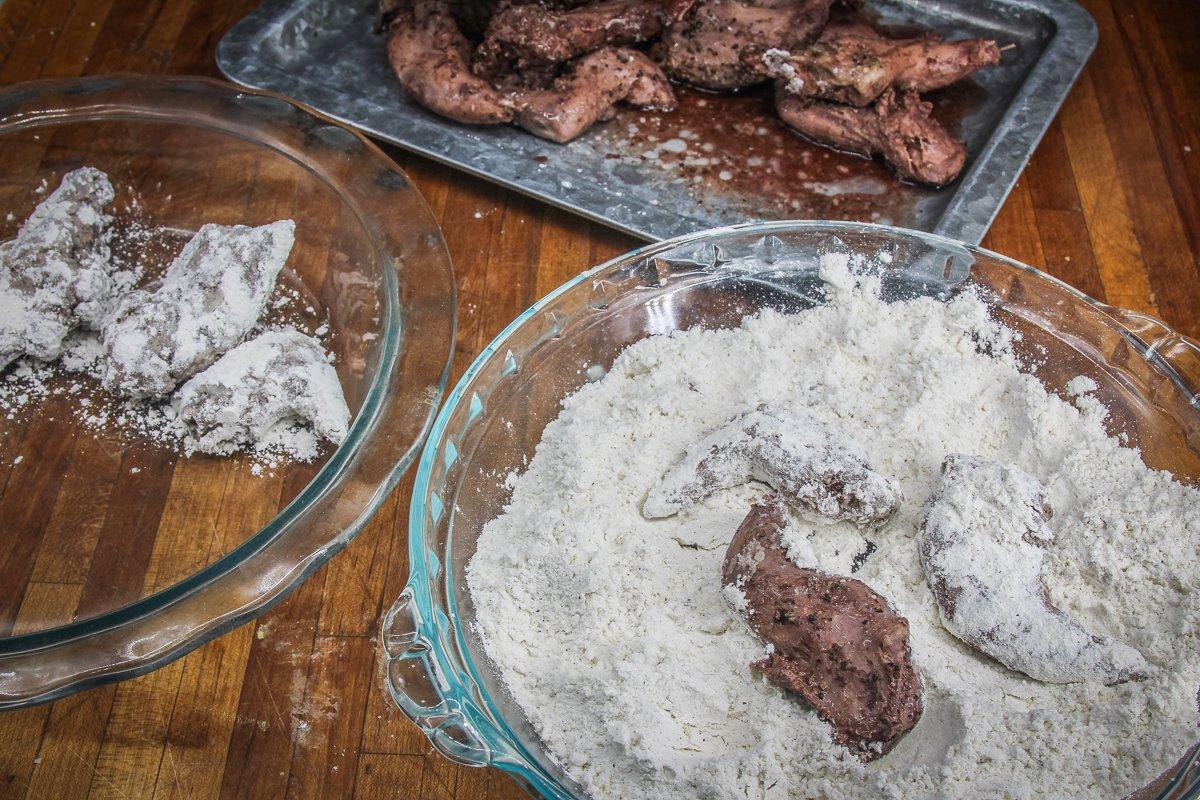 Roll the cooked squirrel in seasoned flour before frying.