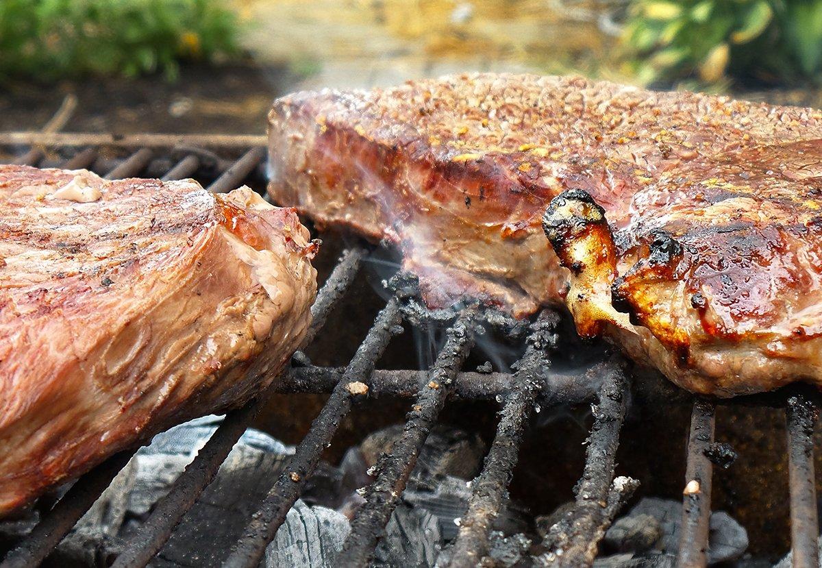 While the sauce simmers, grill the elk steaks to your liking over hot coals.