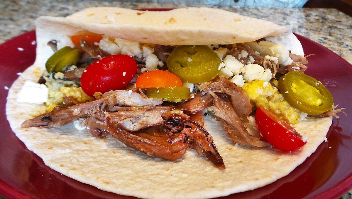 Warm tortillas stuffed with scrambled eggs and shredded duck meat makes for a fine start to the day.