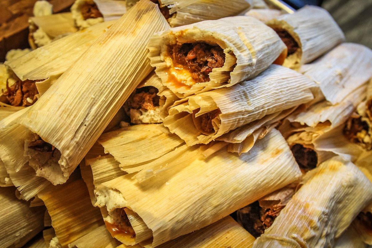 Continue rolling the tamales until all the meat has been used.