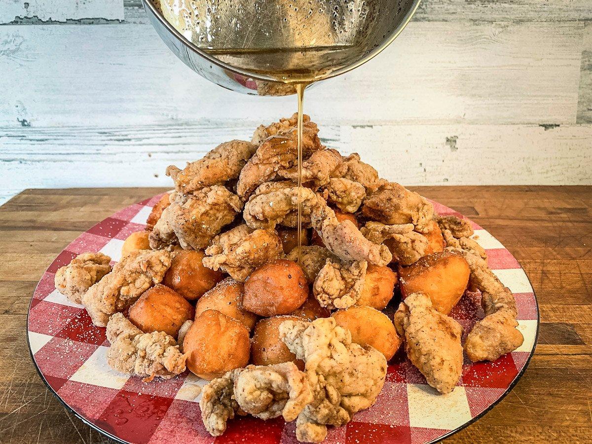 Sweet biscuit bites topped with spicy fried turkey nuggets and drizzled with chili infused honey is a family favorite and is an easy camp fix.
