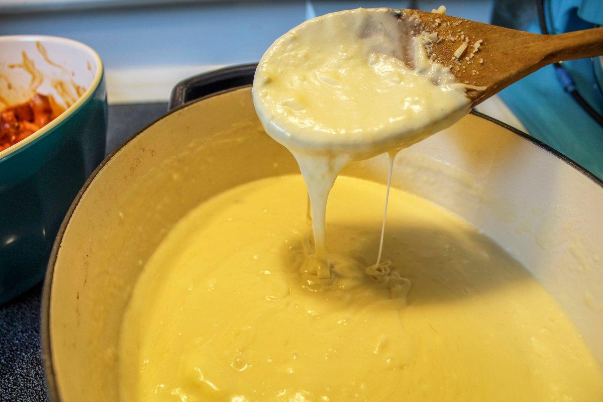 The sauce starts with a butter and flour roux, then gets milk, cream, and a bunch of cheese.