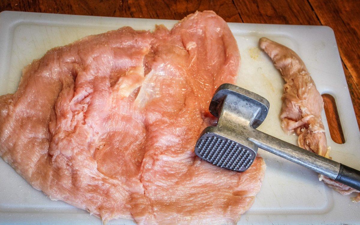 Butterfly the turkey breast, then use a meat mallet to pound it out to an even thickness.