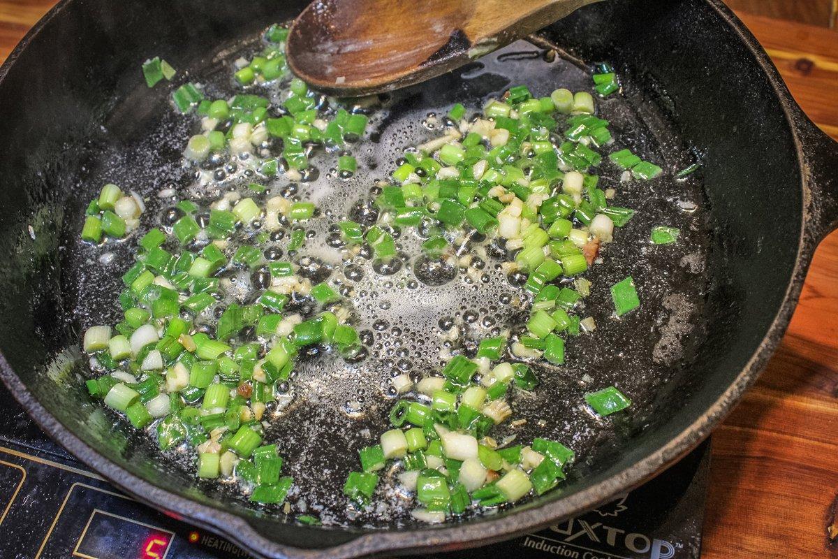 Start the sauce by sauteing the onions and garlic in butter.