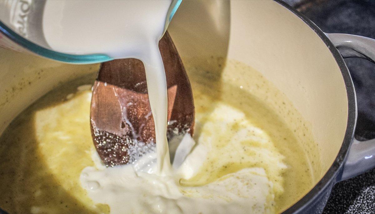 Stir the milk and cream into the flour and butter roux.