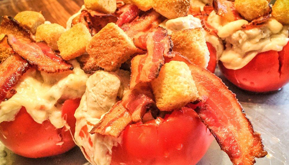 Stuff the tomatoes with the turkey mixture, then top with bacon and croutons before baking.