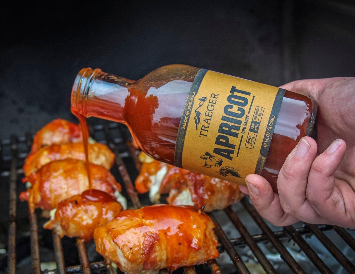 As the poppers grill, glaze them with Traeger Apricot BBQ Sauce.