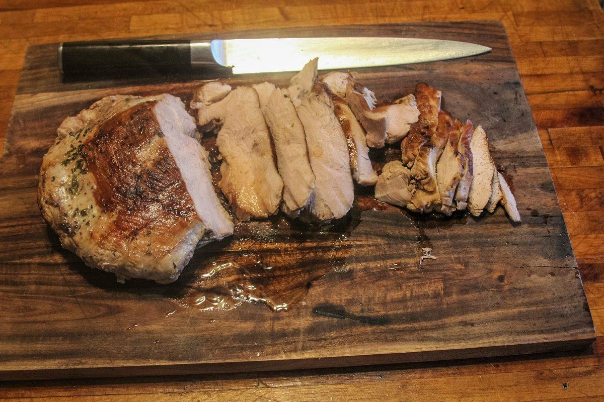 Slice the turkey breast across the grain.