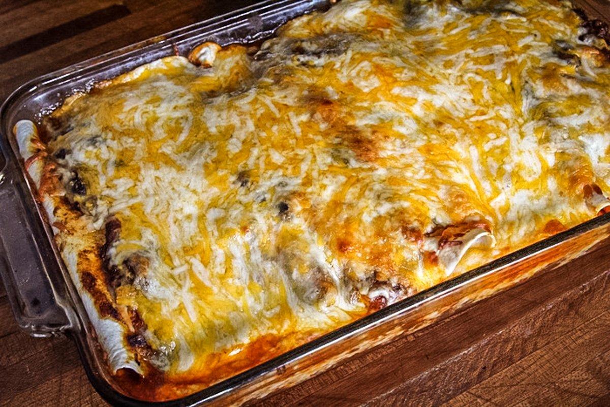 Top the enchiladas with shredded cheese and bake until the cheese has melted.