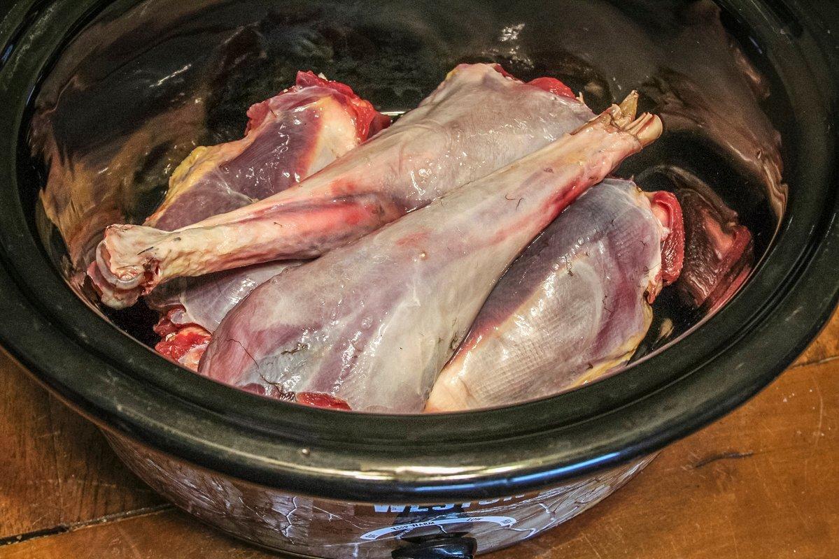 Place the turkey legs and thighs into your slow cooker.