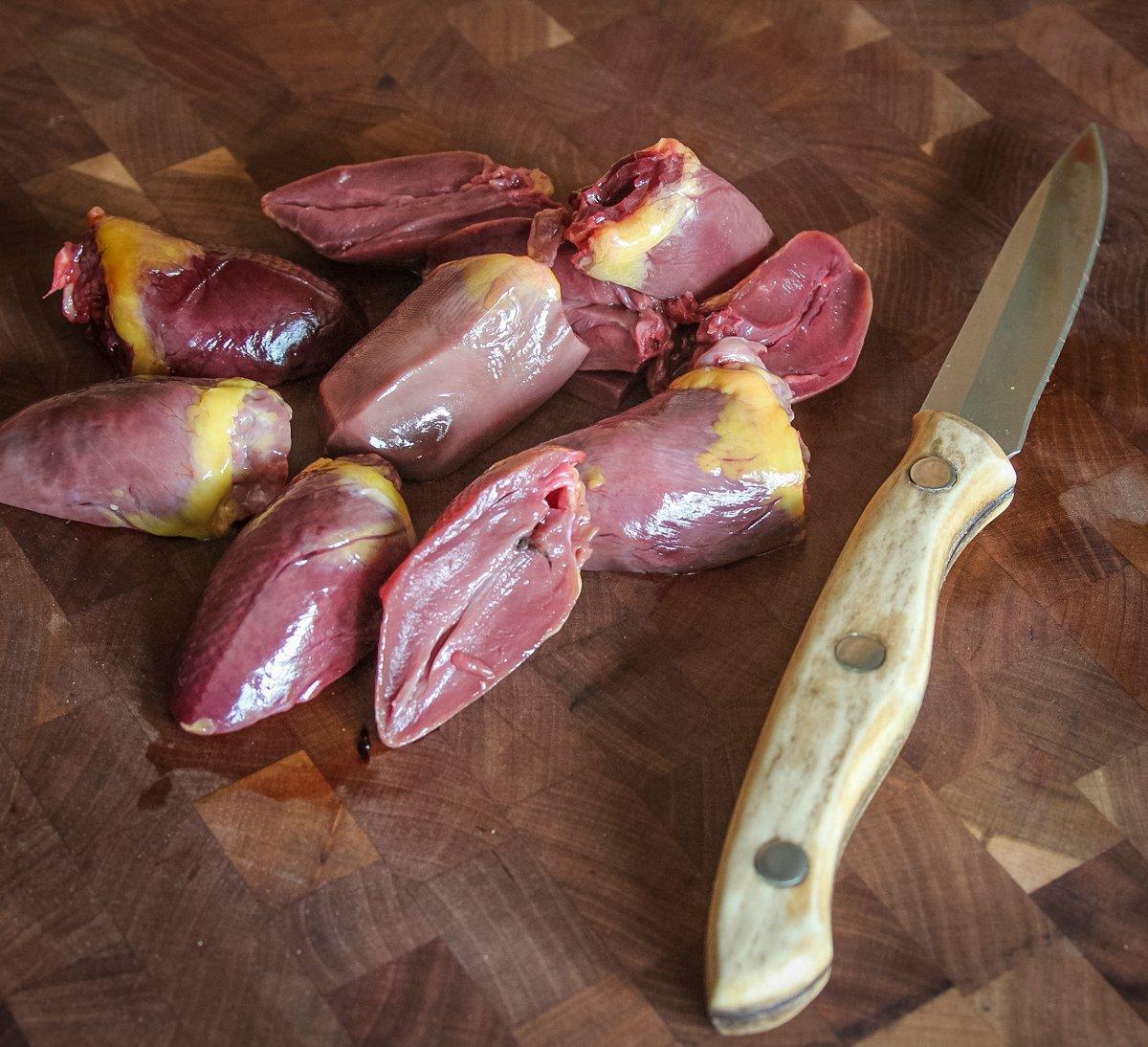 Slice the hearts in half and trim away any connective tissue before marinating.