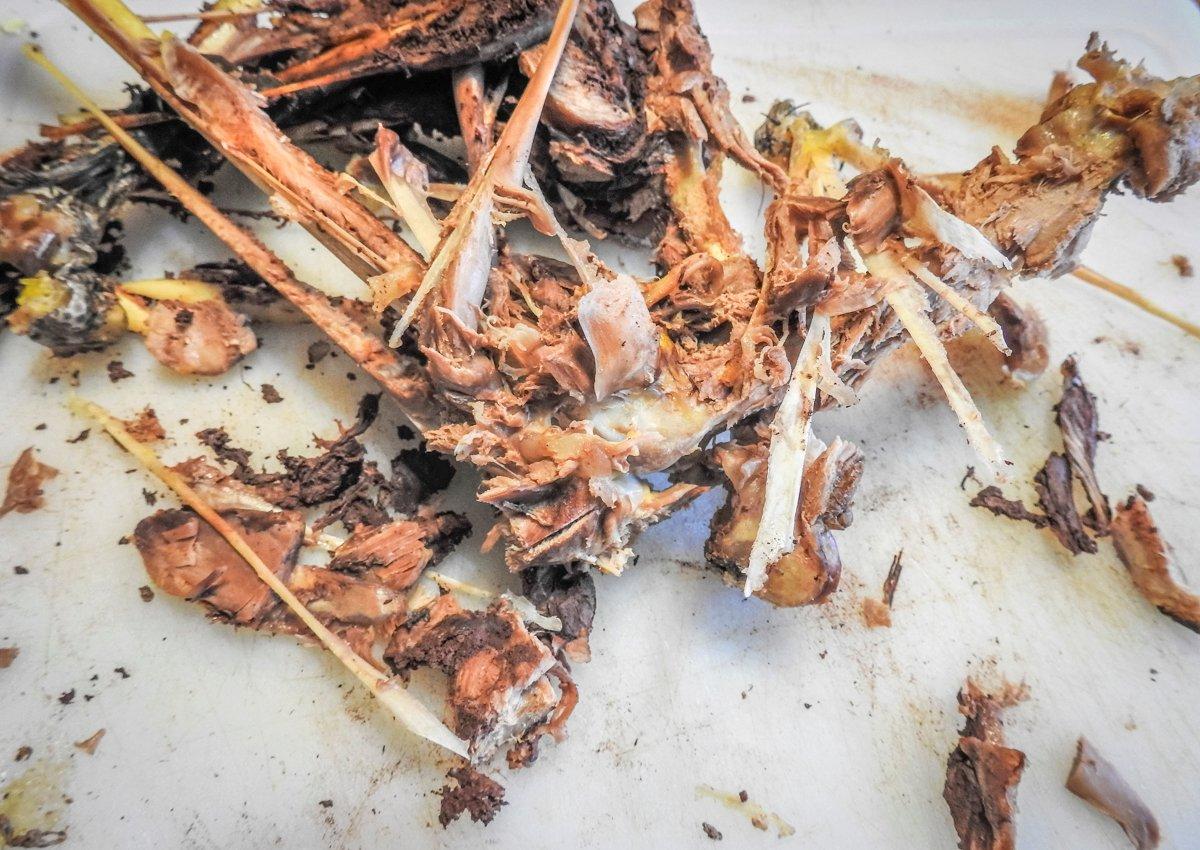 After simmering the turkey for 90 minutes, let the meat cool and pick it from the bone.