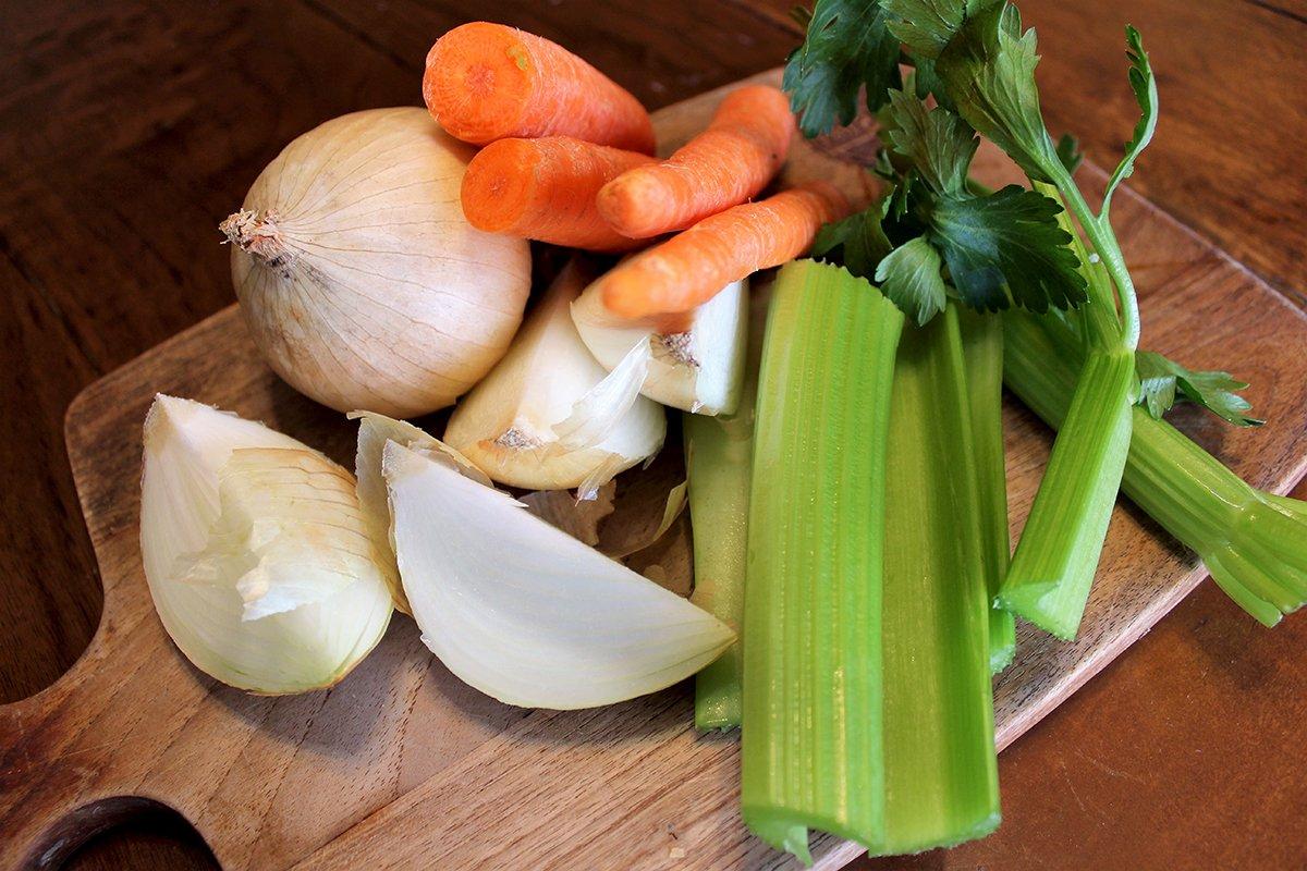 Aromatic vegetables like onion, celery, and carrots help add flavor and body to the stock.