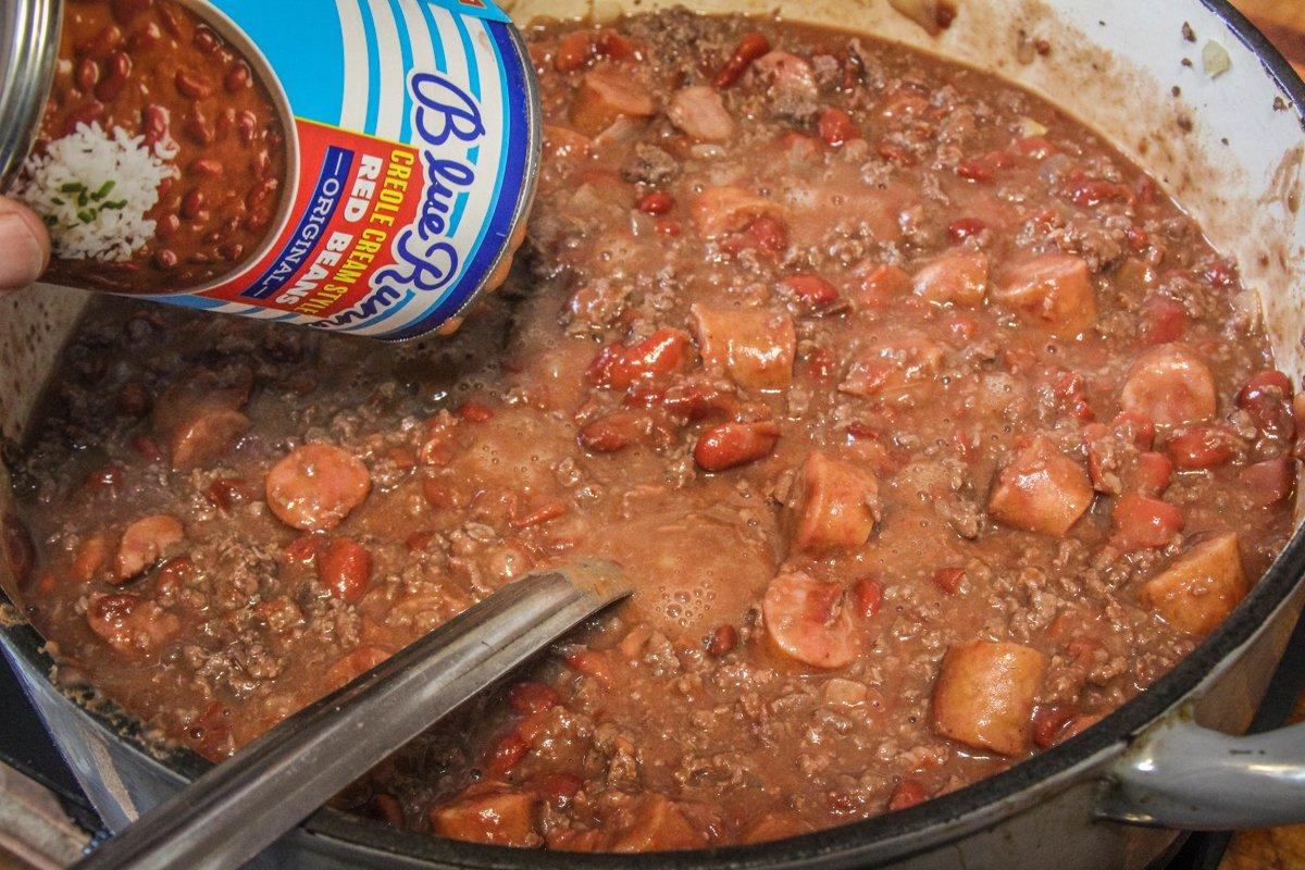 Add the red beans to the pot, then simmer.