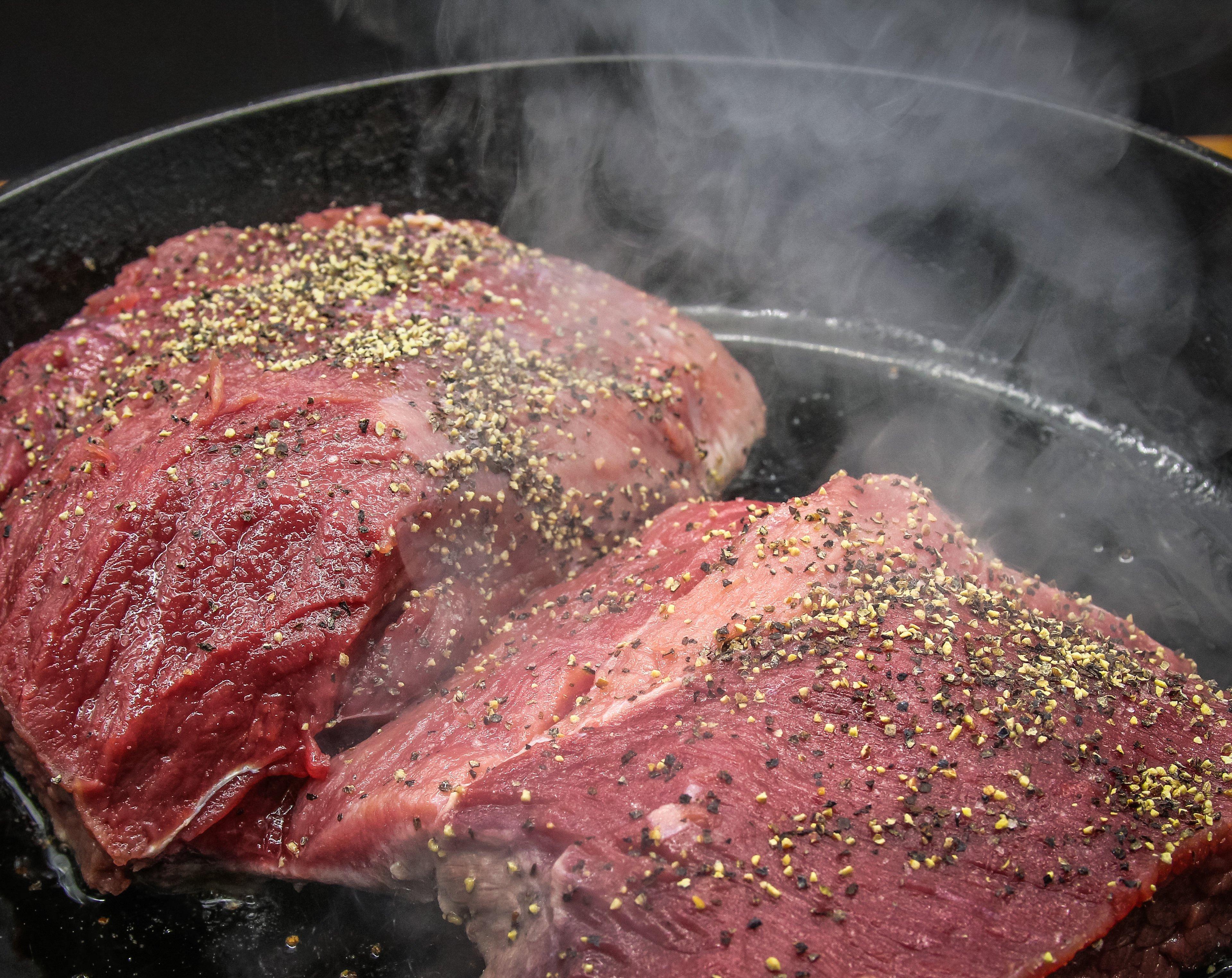 Pan-sear the venison roast before adding it to the slow cooker for extra flavor.