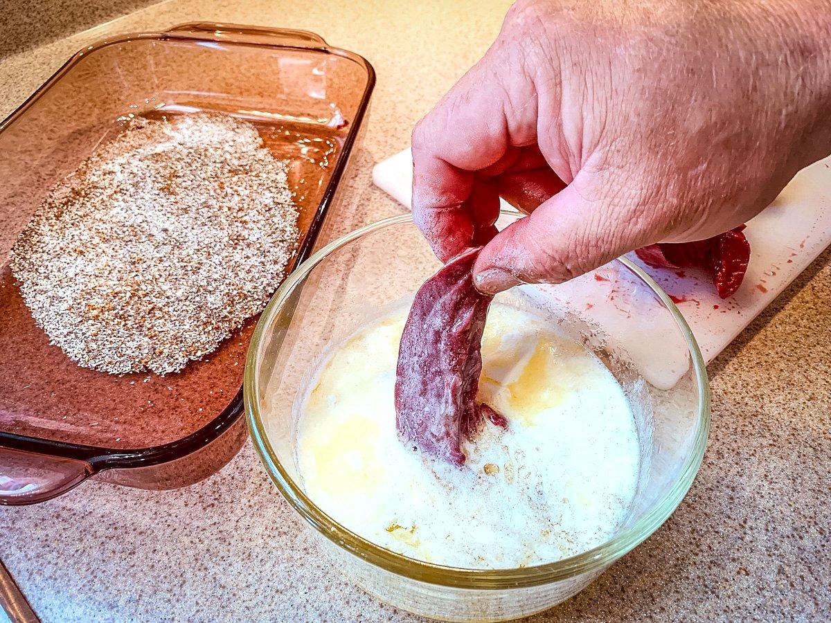 Dip each strip into melted butter.