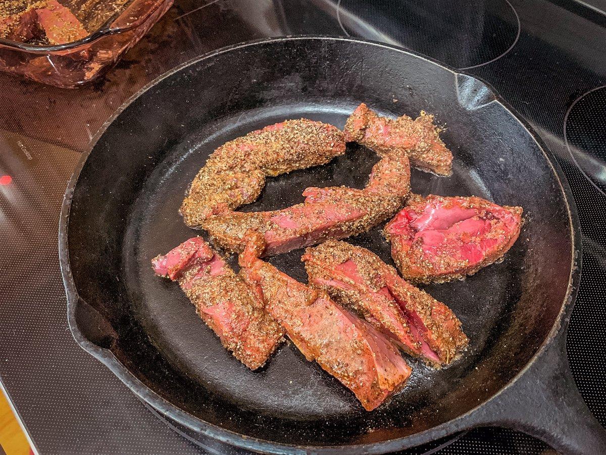 Sear the strips in a dry, hot cast-iron skillet.