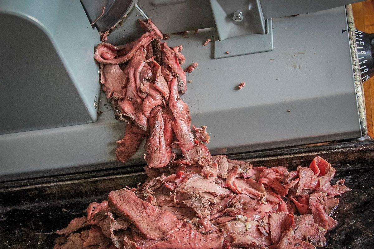 We slice the venison thinly on our Magic Chef Realtree meat slicer.