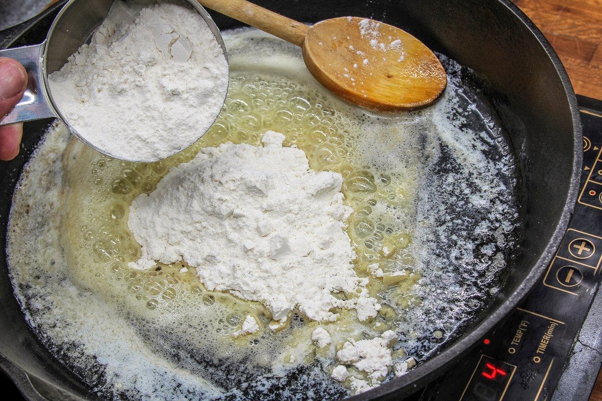 Slowly stir the flour into the melted butter.