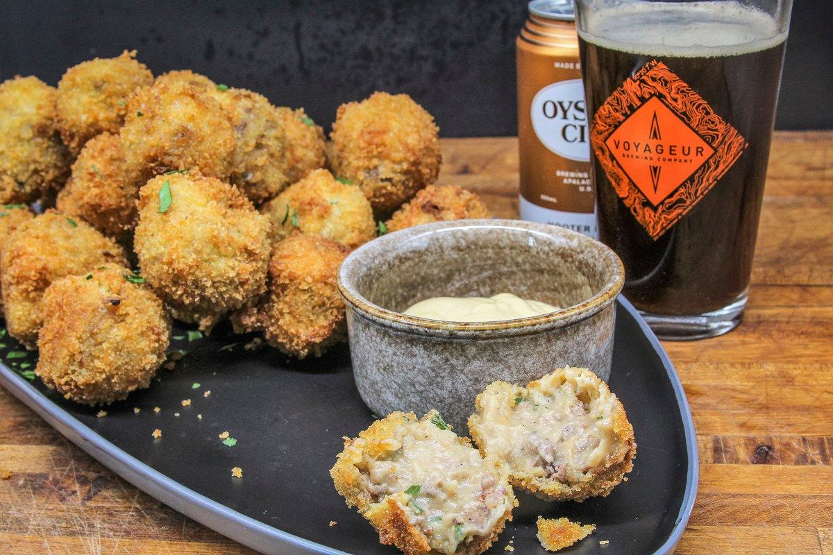 Serve the bitterballen with mustard for dipping and your favorite beer.