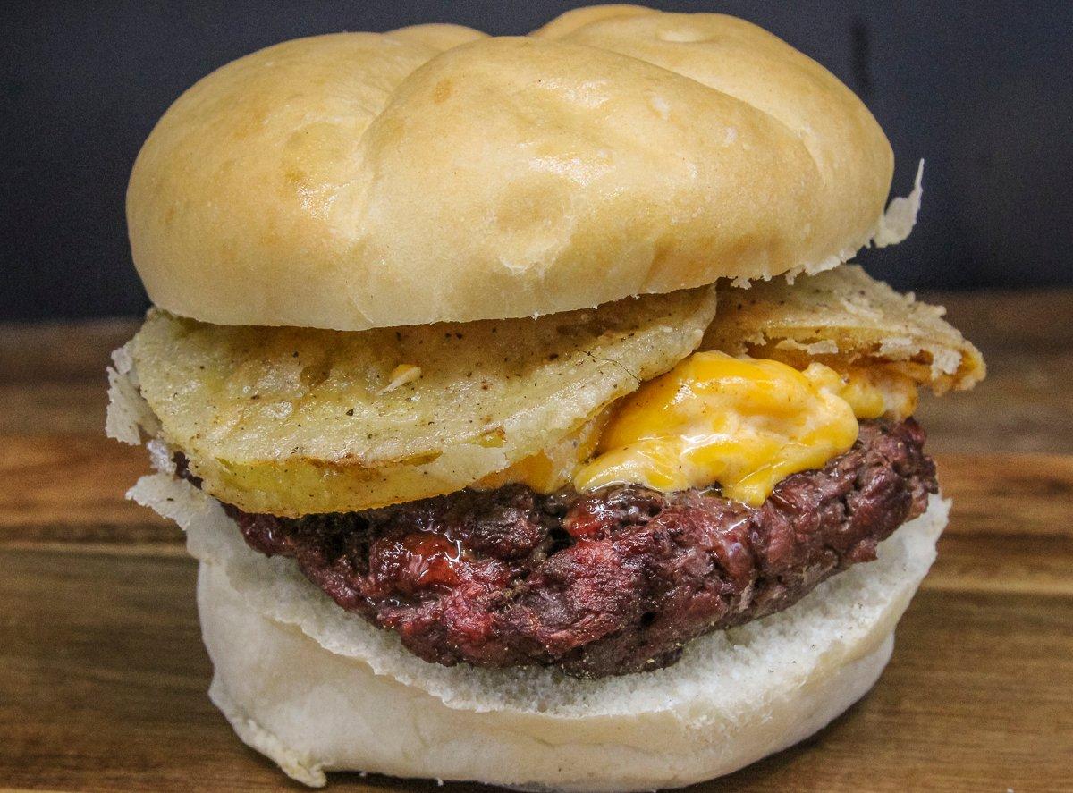 Top the burger with pimento cheese and crispy slices of fried green tomato.