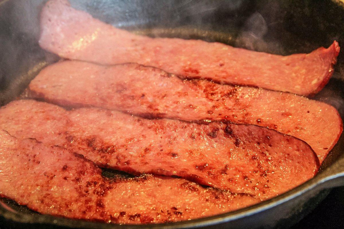 Pan fry the bacon for 3 to 4 minutes per side to crisp.