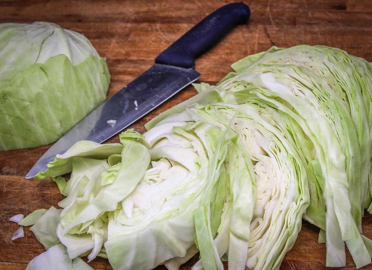 Slice the cabbage into thin strips to speed cooking time.